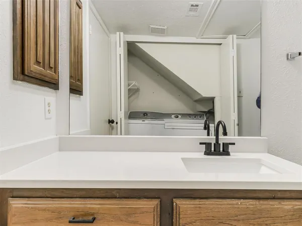 a kitchen with stainless steel appliances granite countertop a refrigerator stove and sink