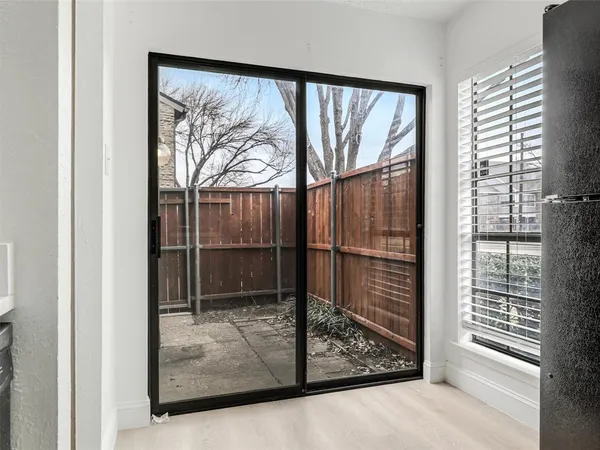 a kitchen with stainless steel appliances granite countertop a refrigerator and cabinets