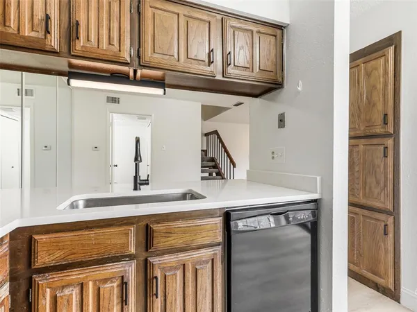 an empty room with a ceiling fan and window