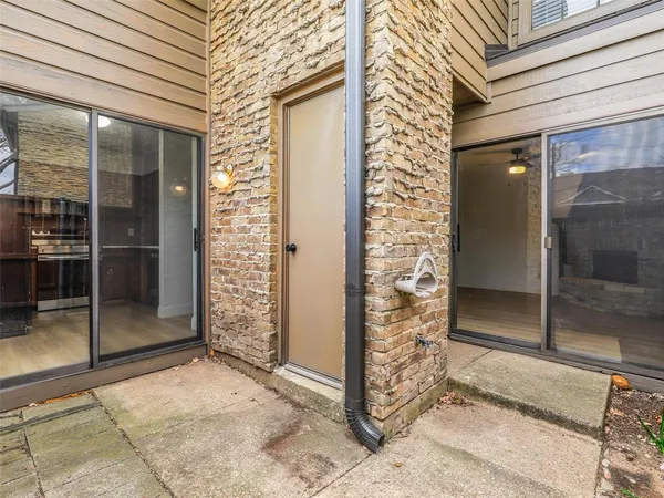 a view of city street with large trees