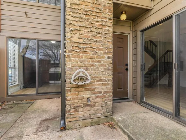 a view of a house with a yard and plants