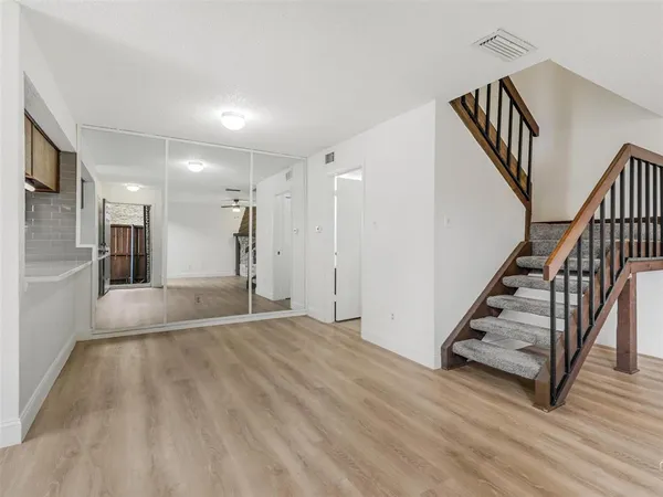 a view of empty room with fireplace