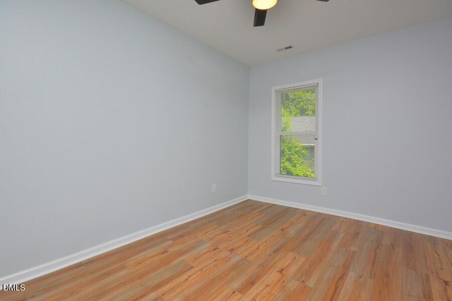 1030 Cornell Street, Unit B Durham, NC 27707 - Photo 19 of 22 an empty room with window