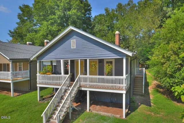 a view of a house with a deck front of a house