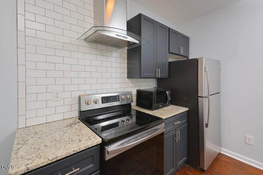 1030 Cornell Street, Unit B Durham, NC 27707 - Photo 22 of 22 a kitchen with a stove and a refrigerator
