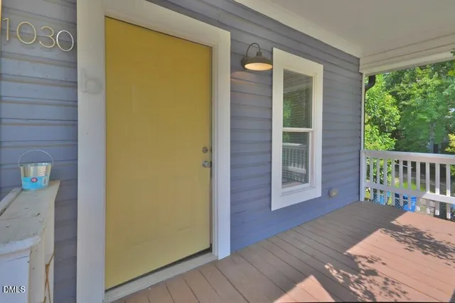 a view of a balcony with wooden floor