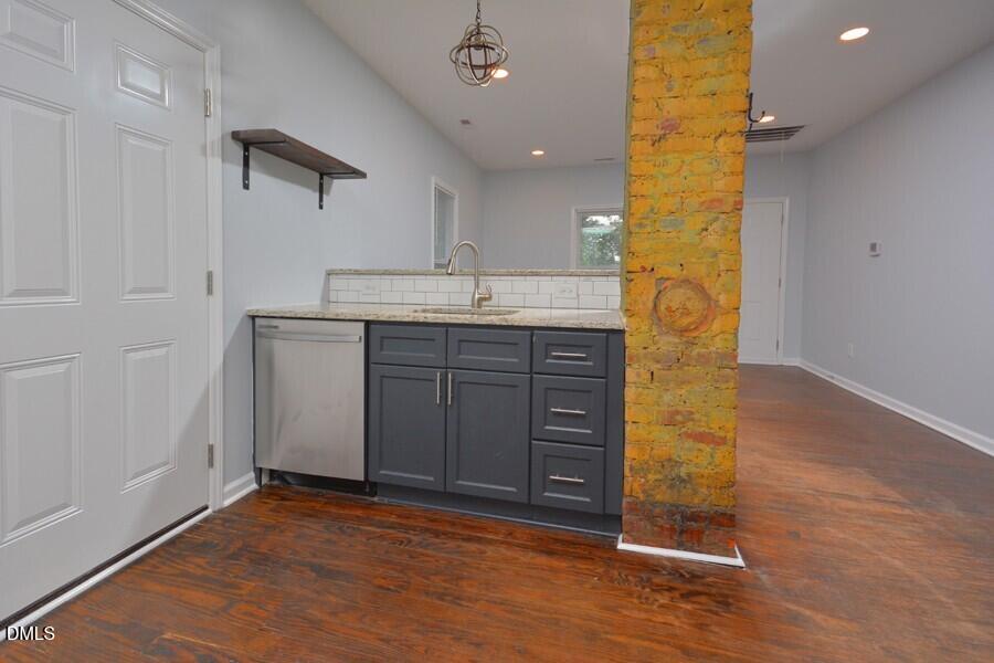 1030 Cornell Street, Unit B Durham, NC 27707 - Photo 8 of 22 wooden floor in an empty room with a kitchen