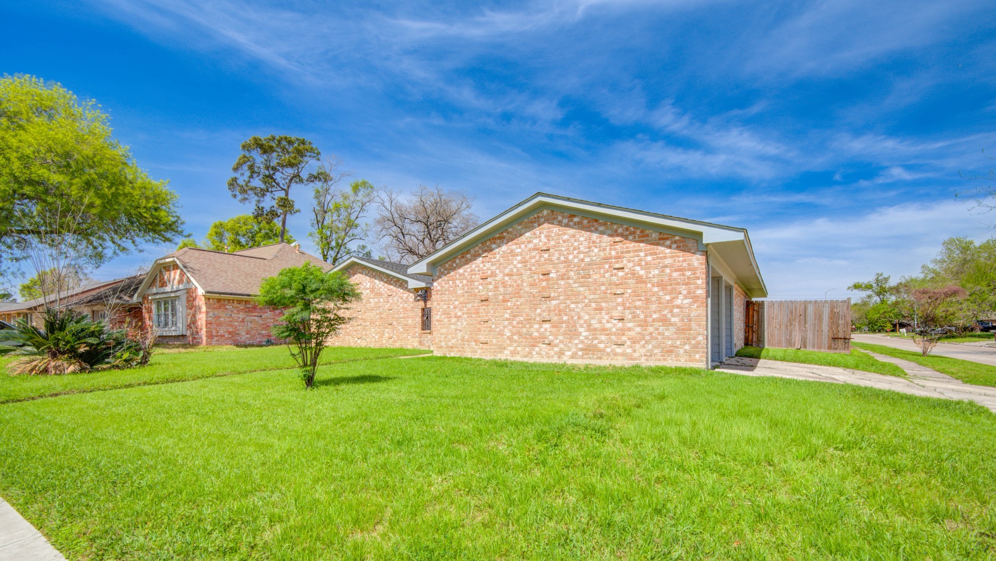 13747 Rampchester Lane Houston, TX 77015 - Photo 3 of 24 a view of a backyard with a garden