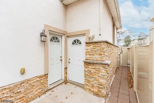 a kitchen with stainless steel appliances granite countertop a stove and a refrigerator