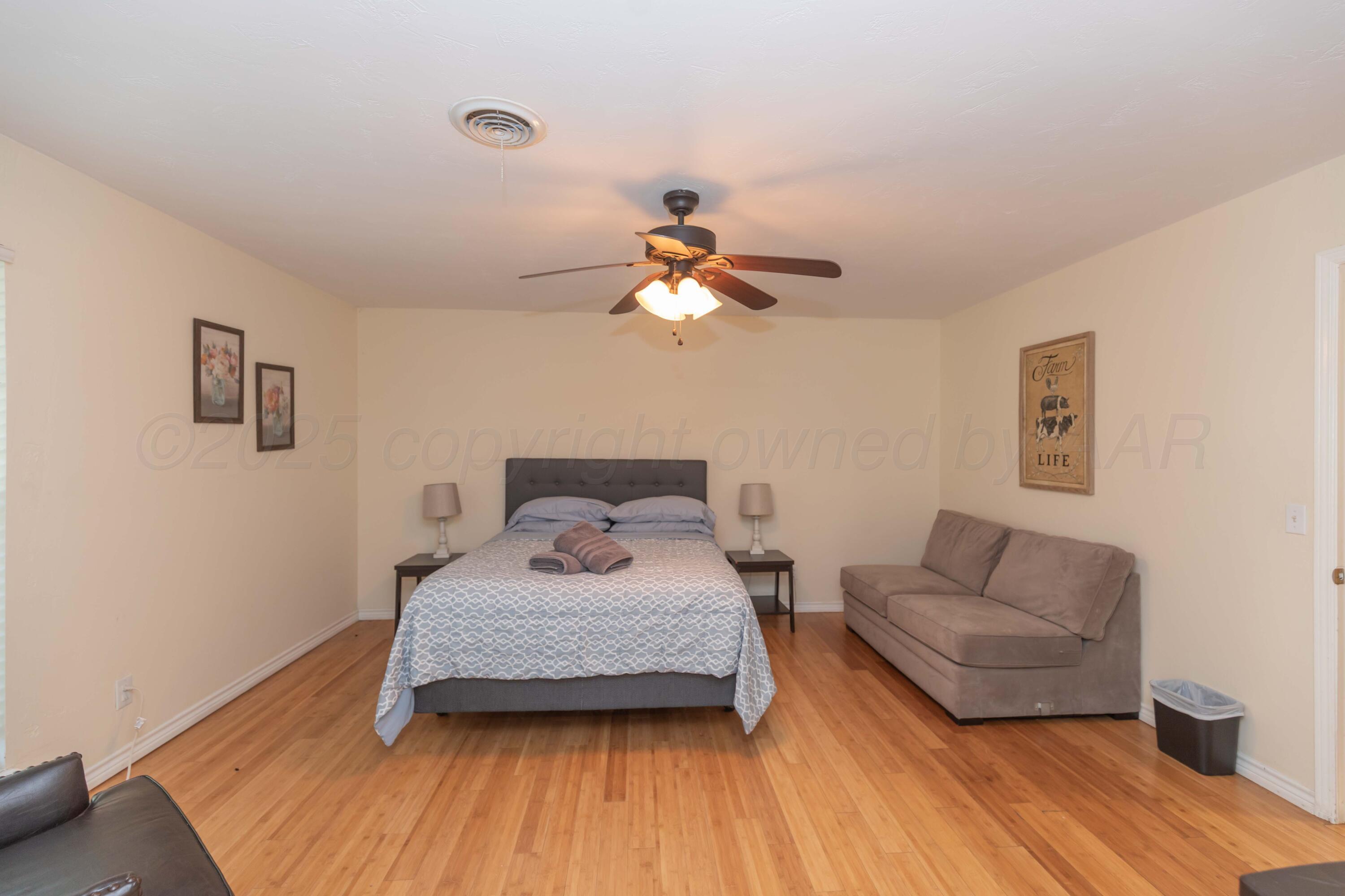 4427 Summit Circle Amarillo, TX 79109 - Photo 26 of 50 a bedroom with a bed and a couch
