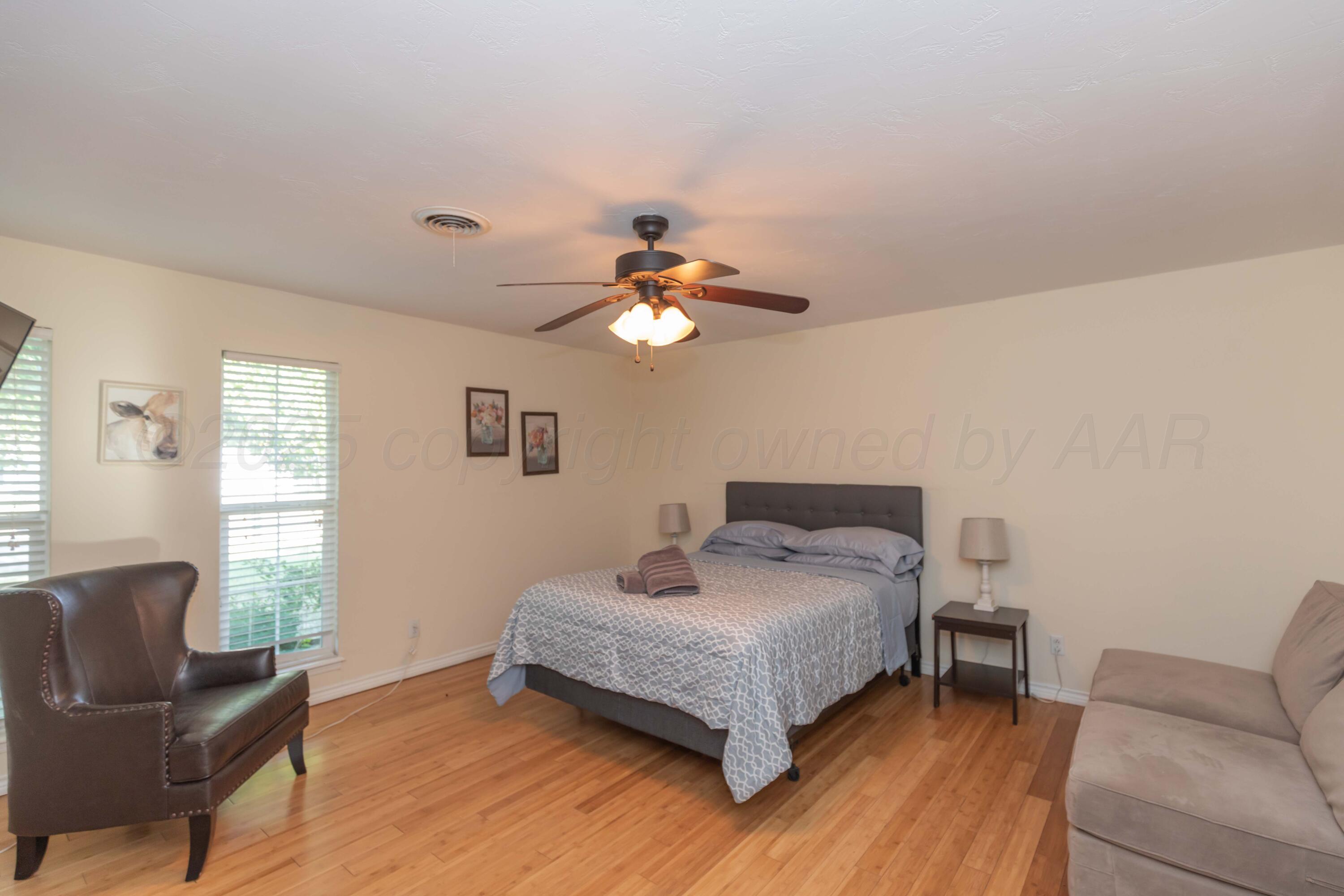 4427 Summit Circle Amarillo, TX 79109 - Photo 28 of 50 a bedroom with a bed and window