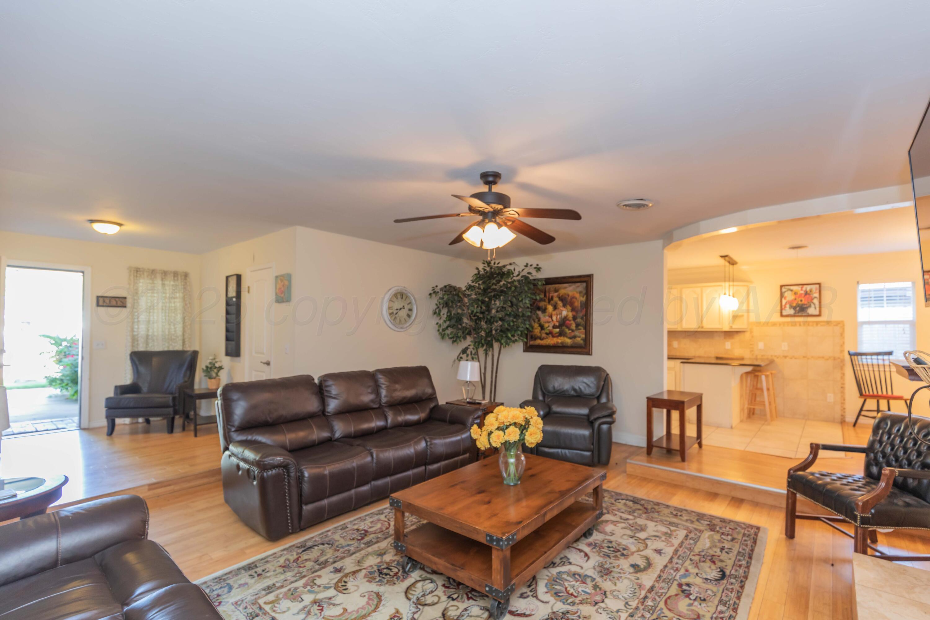 4427 Summit Circle Amarillo, TX 79109 - Photo 3 of 50 a living room with furniture and wooden floor