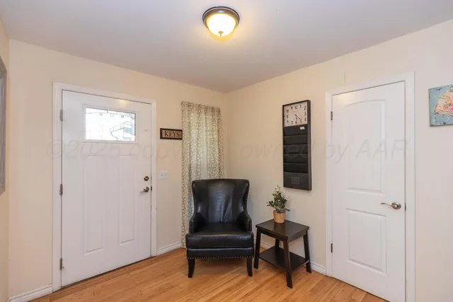 a view of a livingroom with furniture and a workspace