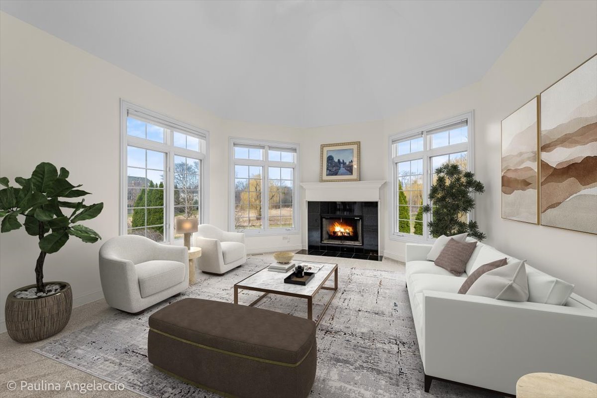 1175 Woodburn Court Inverness, IL 60067 - Photo 21 of 68 a living room with furniture potted plant and a fireplace