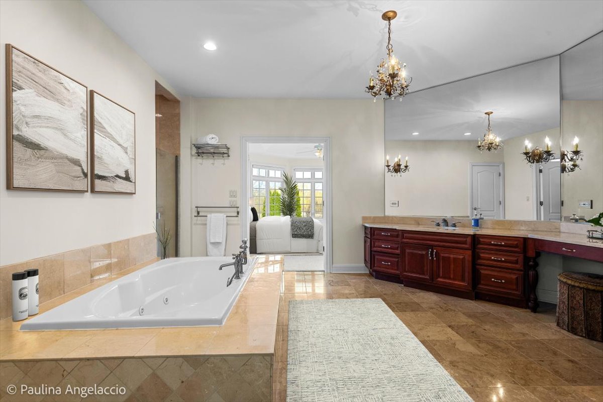 1175 Woodburn Court Inverness, IL 60067 - Photo 27 of 68 a large spacious bathroom with a large tub shower and sink