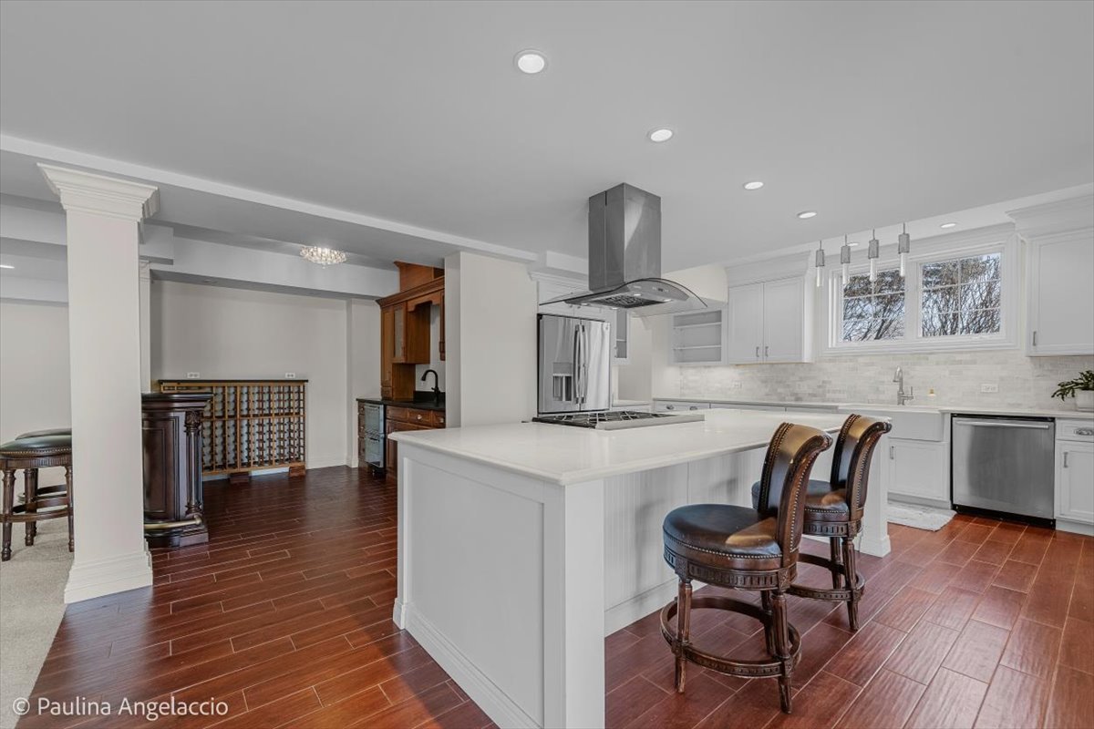 1175 Woodburn Court Inverness, IL 60067 - Photo 42 of 68 a view of a kitchen with cabinets and wooden floor