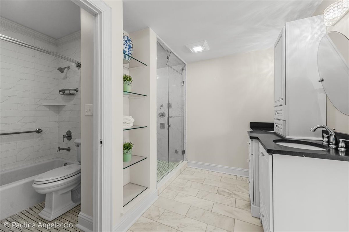 1175 Woodburn Court Inverness, IL 60067 - Photo 47 of 68 a bathroom with a sink toilet and shower