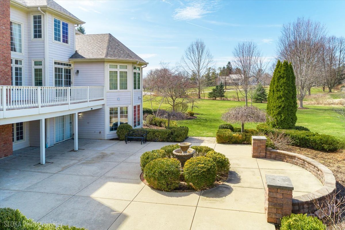1175 Woodburn Court Inverness, IL 60067 - Photo 54 of 68 a view of a house with backyard and sitting area