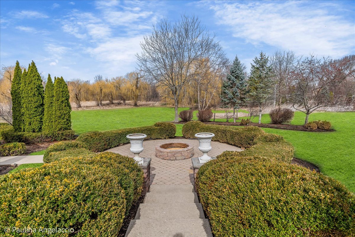 1175 Woodburn Court Inverness, IL 60067 - Photo 55 of 68 a view of a garden with an outdoor seating