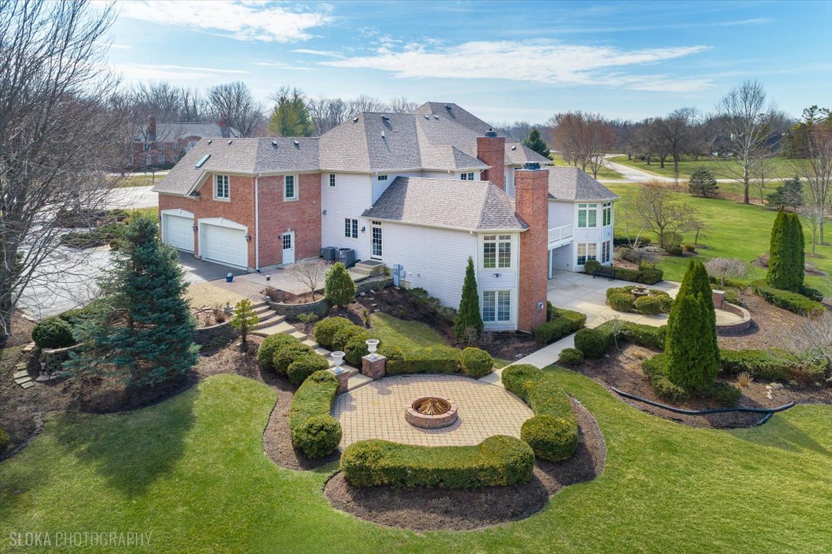 1175 Woodburn Court Inverness, IL 60067 - Photo 60 of 68 an aerial view of a house with yard swimming pool and outdoor seating