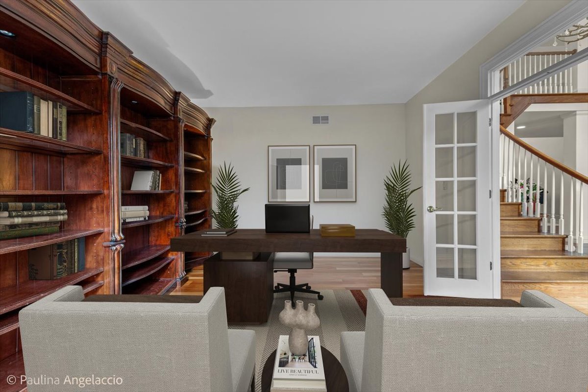 1175 Woodburn Court Inverness, IL 60067 - Photo 9 of 68 a living room with furniture and a book shelf