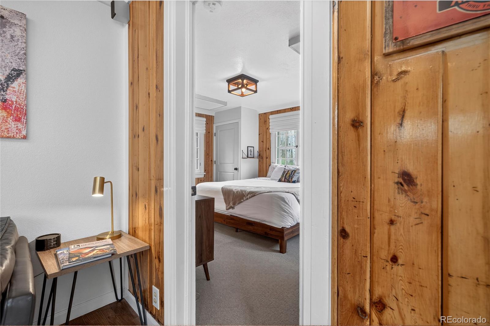 327 Vasquez Road, Unit E1 Winter Park, CO 80482 - Photo 20 of 43 a bedroom with a bed and a chair