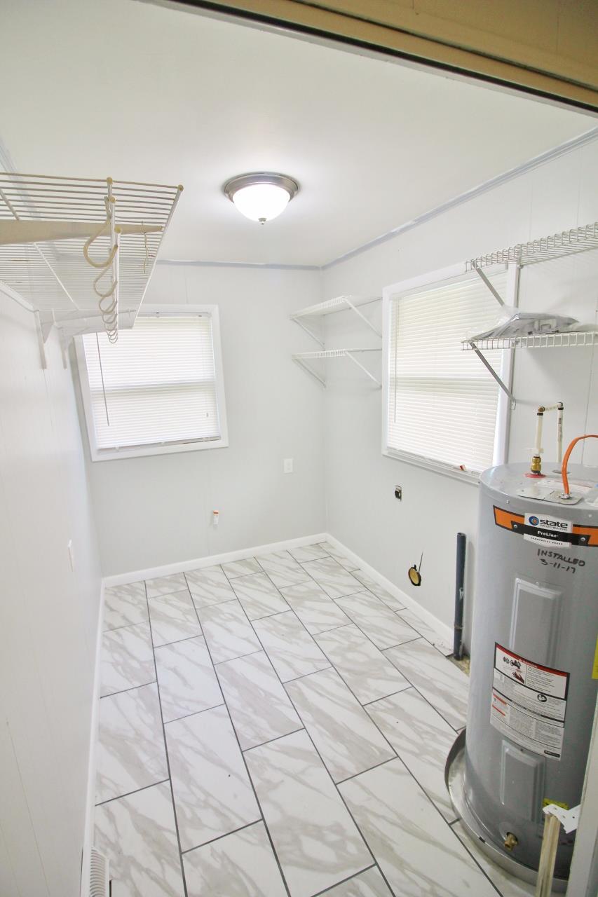 1865 Walnut Grove Road Lebanon, TN 37090 - Photo 12 of 25 a bedroom with a bed and a mirror