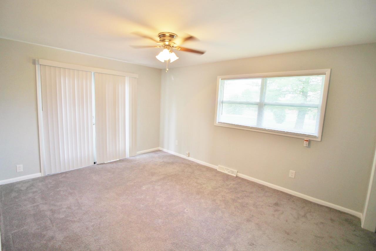 1865 Walnut Grove Road Lebanon, TN 37090 - Photo 14 of 25 an empty room with windows and chandelier fan