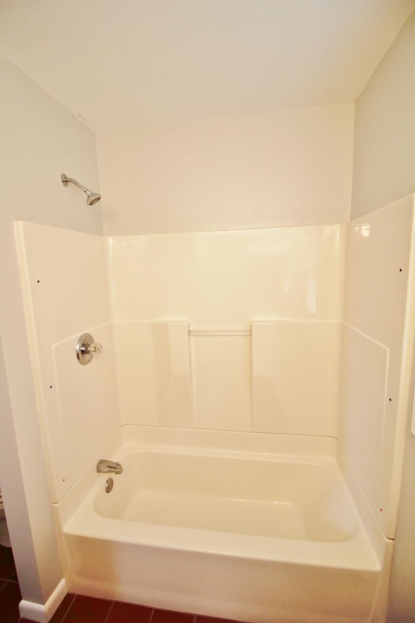 1865 Walnut Grove Road Lebanon, TN 37090 - Photo 21 of 25 a bathroom with a bathtub and shower
