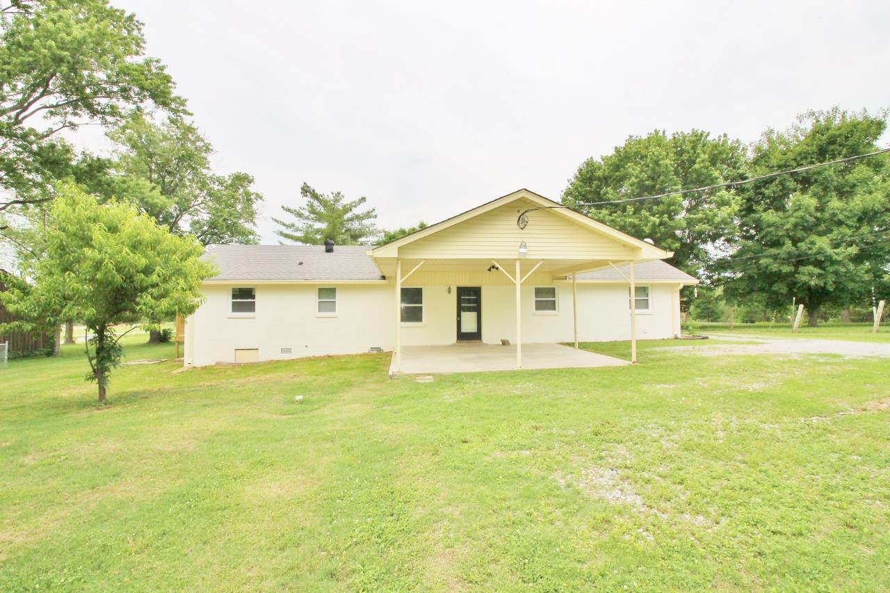 1865 Walnut Grove Road Lebanon, TN 37090 - Photo 23 of 25 a view of a house with a yard and a garage