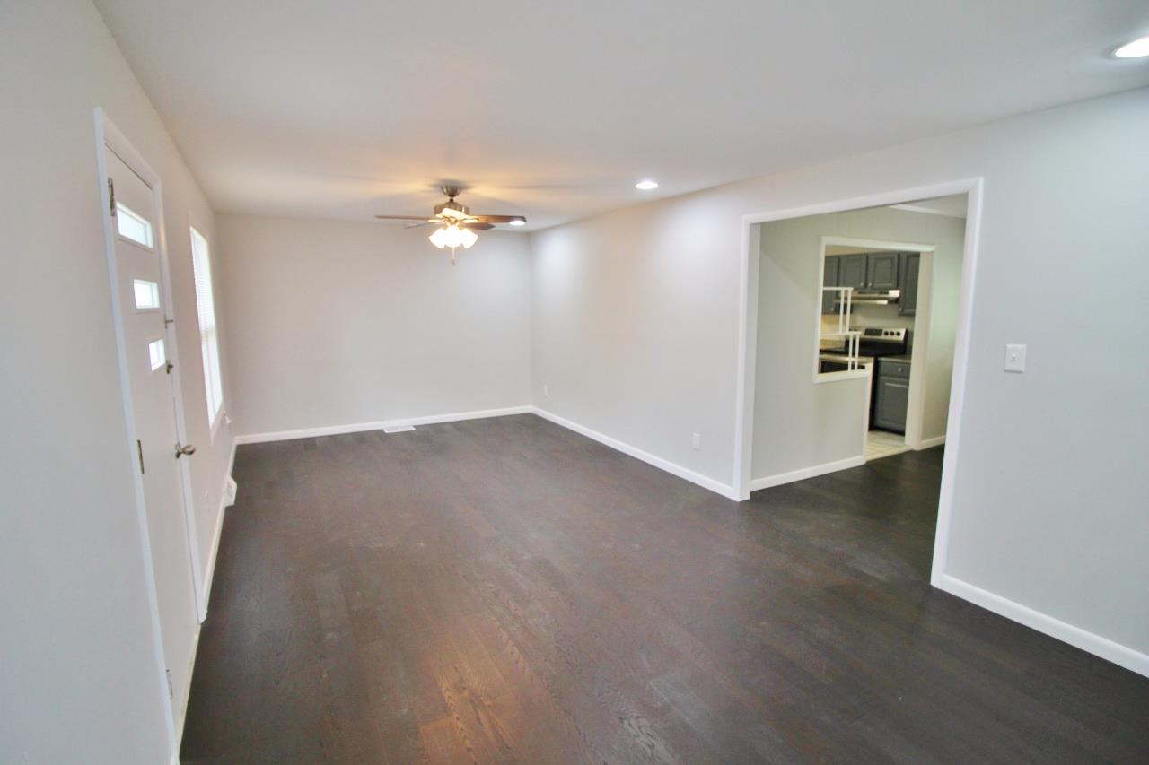 1865 Walnut Grove Road Lebanon, TN 37090 - Photo 5 of 25 an empty room with wooden floor and a ceiling fan