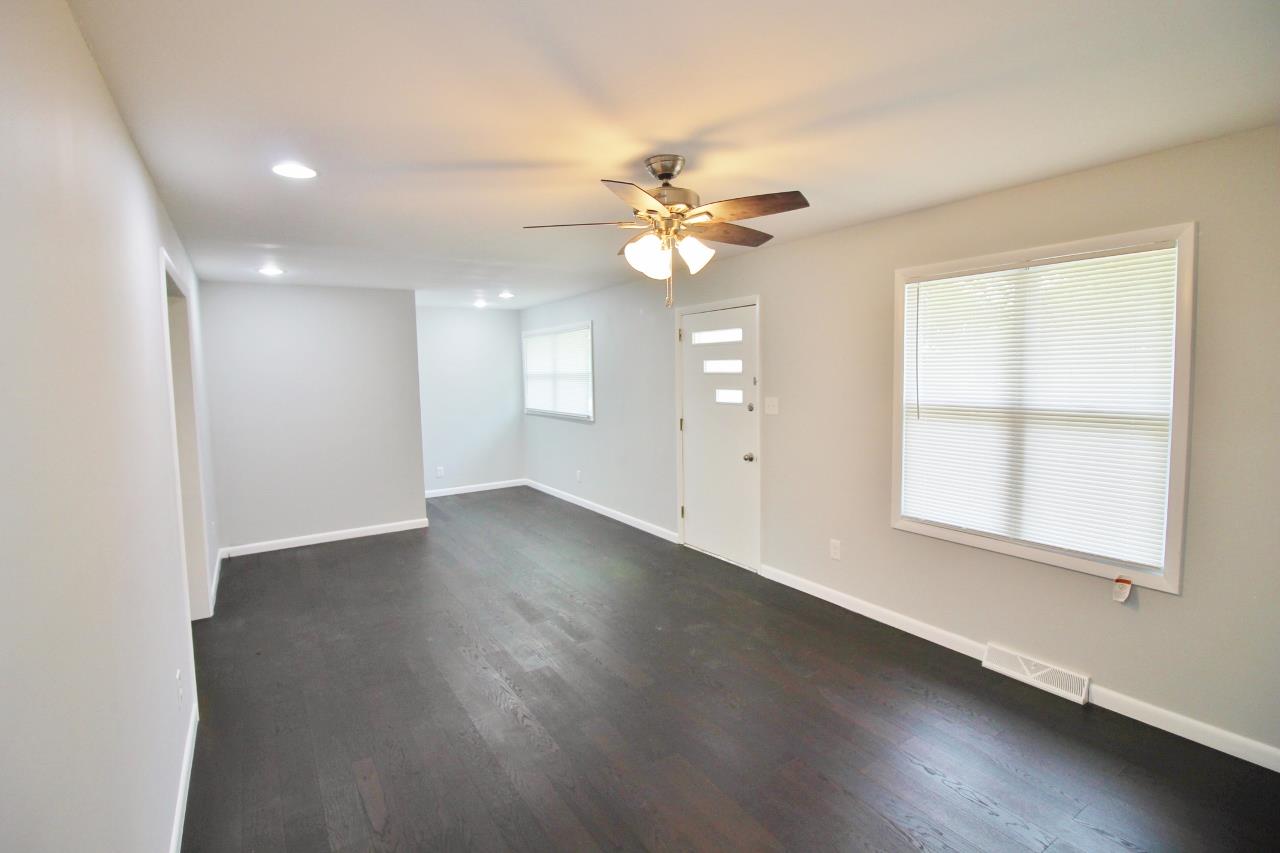 1865 Walnut Grove Road Lebanon, TN 37090 - Photo 7 of 25 an empty room with wooden floor and windows