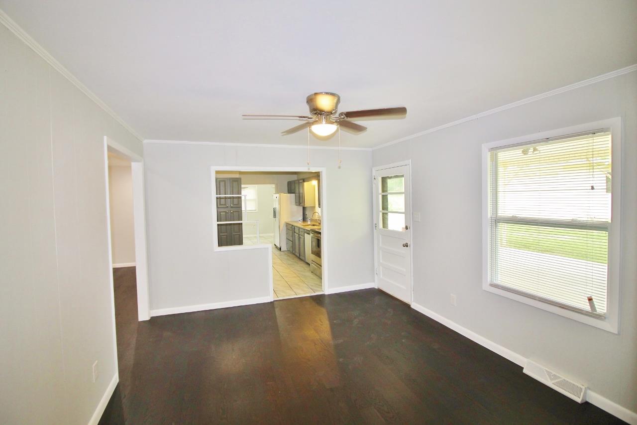 1865 Walnut Grove Road Lebanon, TN 37090 - Photo 9 of 25 a view of an empty room with window and wooden floor