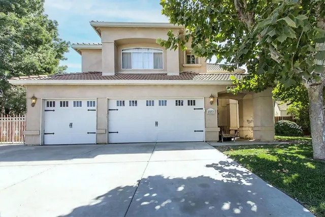 a large building with a large tree in front of it