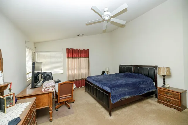 a bathroom with a tub sink double vanity and tub