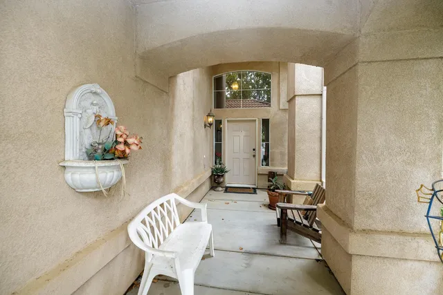 a living room with furniture and a painting