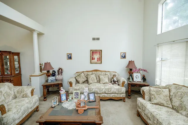 a living room with furniture and a couch