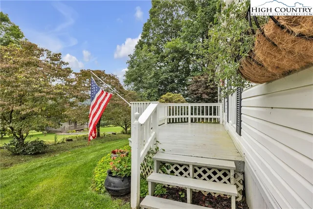 a view of a wooden fence and a bench