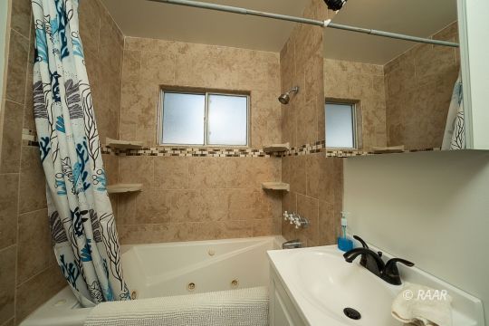 428 North Warner Street Ridgecrest, CA 93555 - Photo 10 of 21 a bathroom with a sink and a bathtub