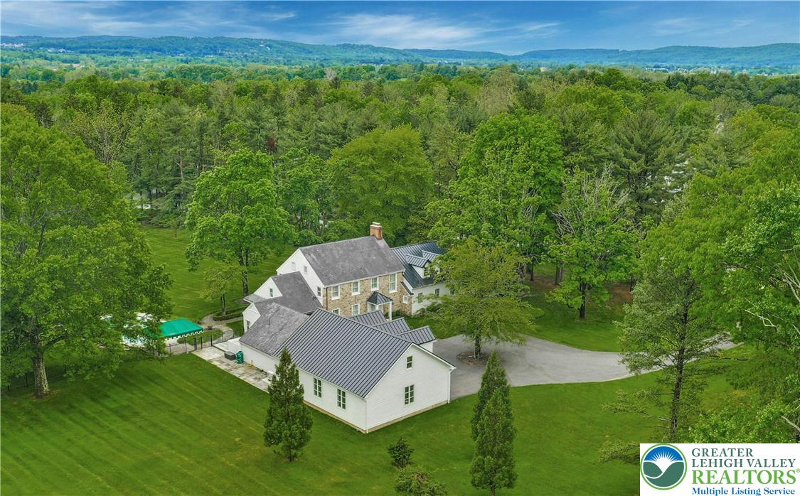 a view of a chair and table in the garden