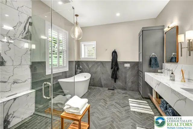 a bathroom with a sink mirror toilet and shower