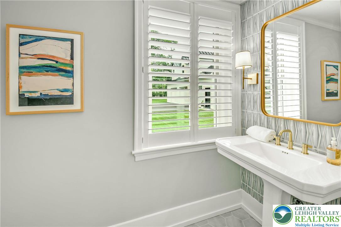 1803 Apple Tree Lane Bethlehem, PA 18015 - Photo 18 of 46 a bathroom with a sink a vanity and a large window