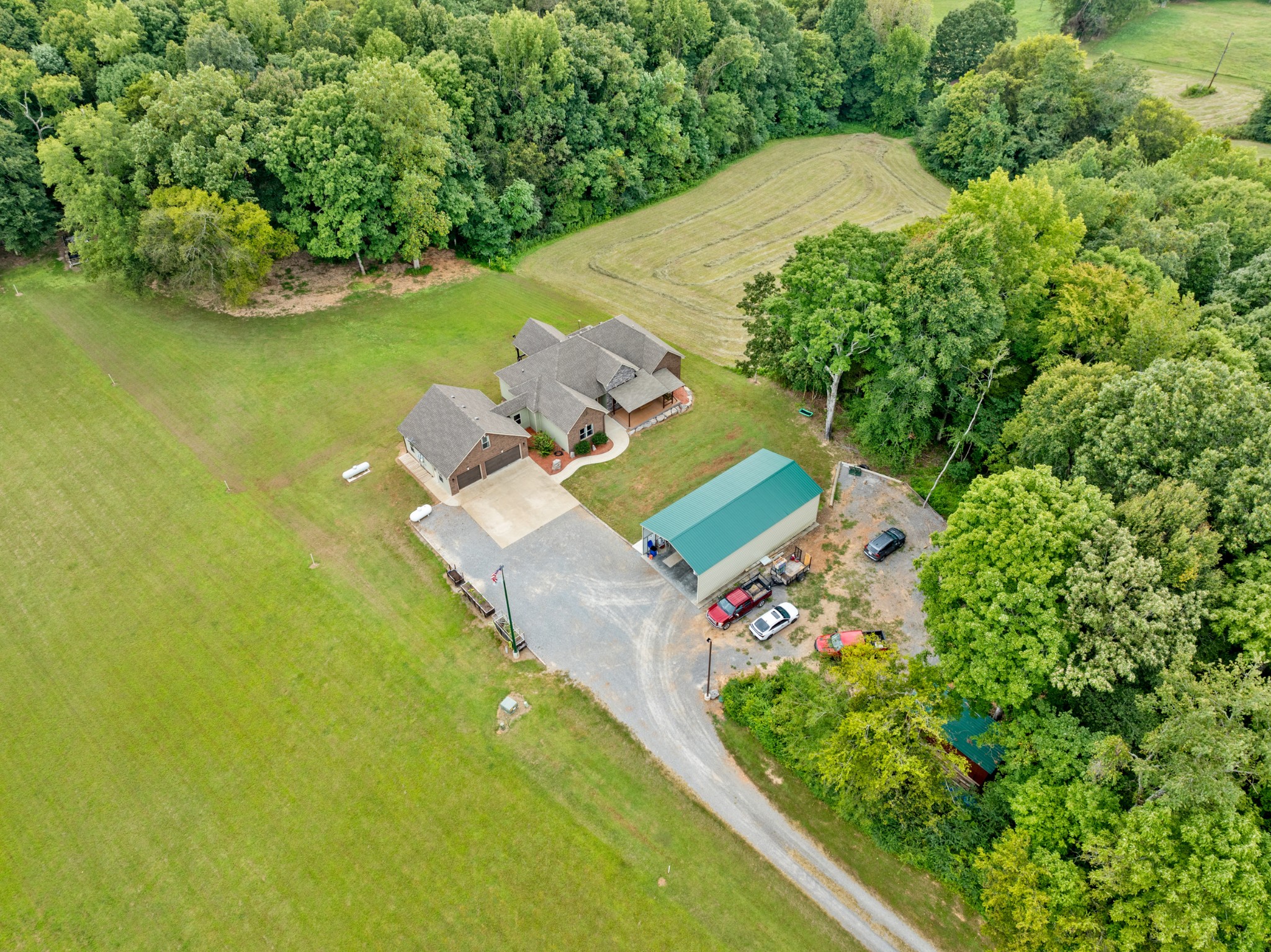 1506 Bend Road Clarksville, TN 37040 - Photo 52 of 56 an aerial view of a house with a garden and lake view