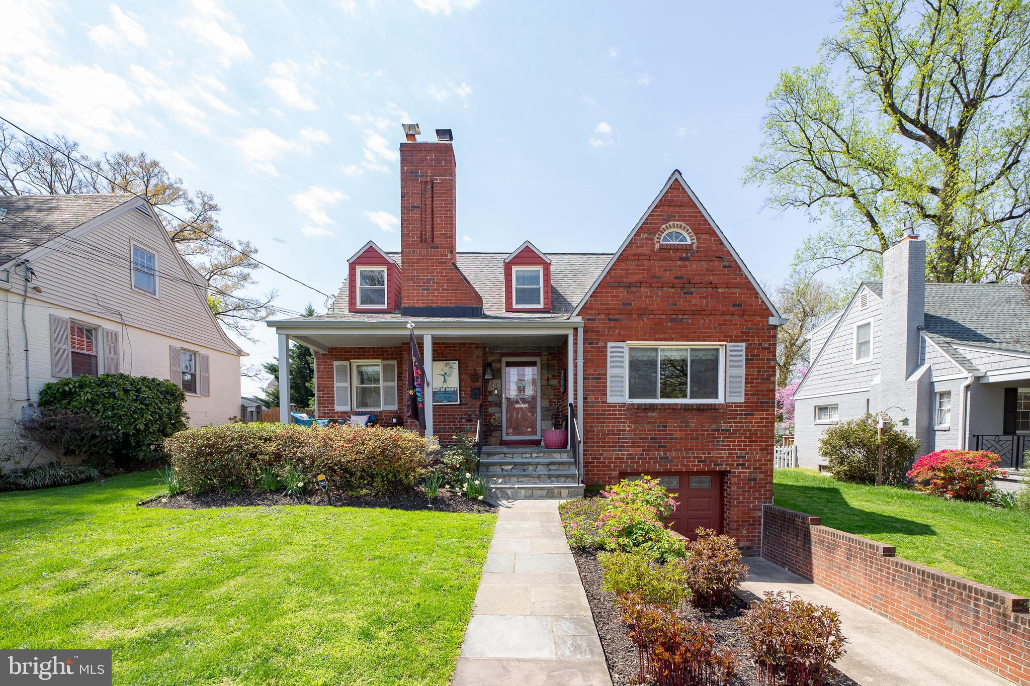 311 Timberwood Avenue Silver Spring, MD 20901 - Photo 1 of 44 a front view of a house with garden