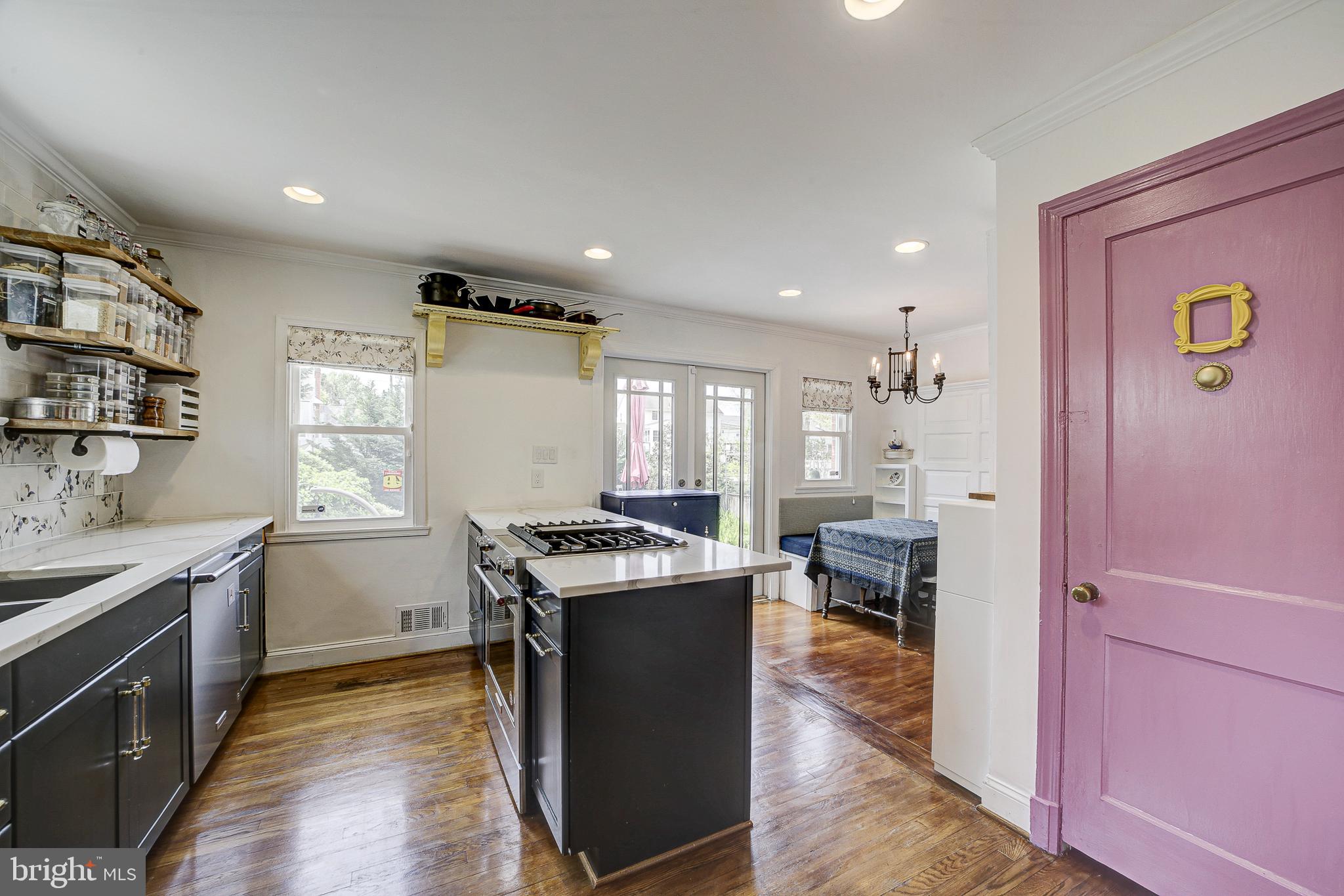 311 Timberwood Avenue Silver Spring, MD 20901 - Photo 11 of 44 a kitchen with a sink stove and cabinets