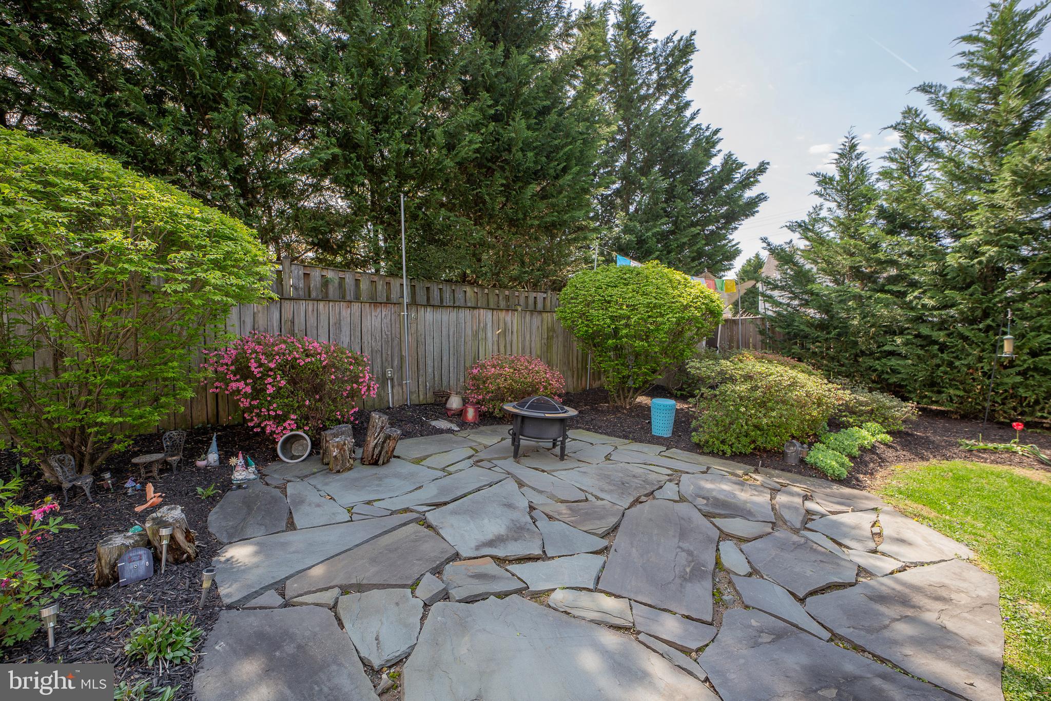 311 Timberwood Avenue Silver Spring, MD 20901 - Photo 17 of 44 a view of a table and chairs in backyard
