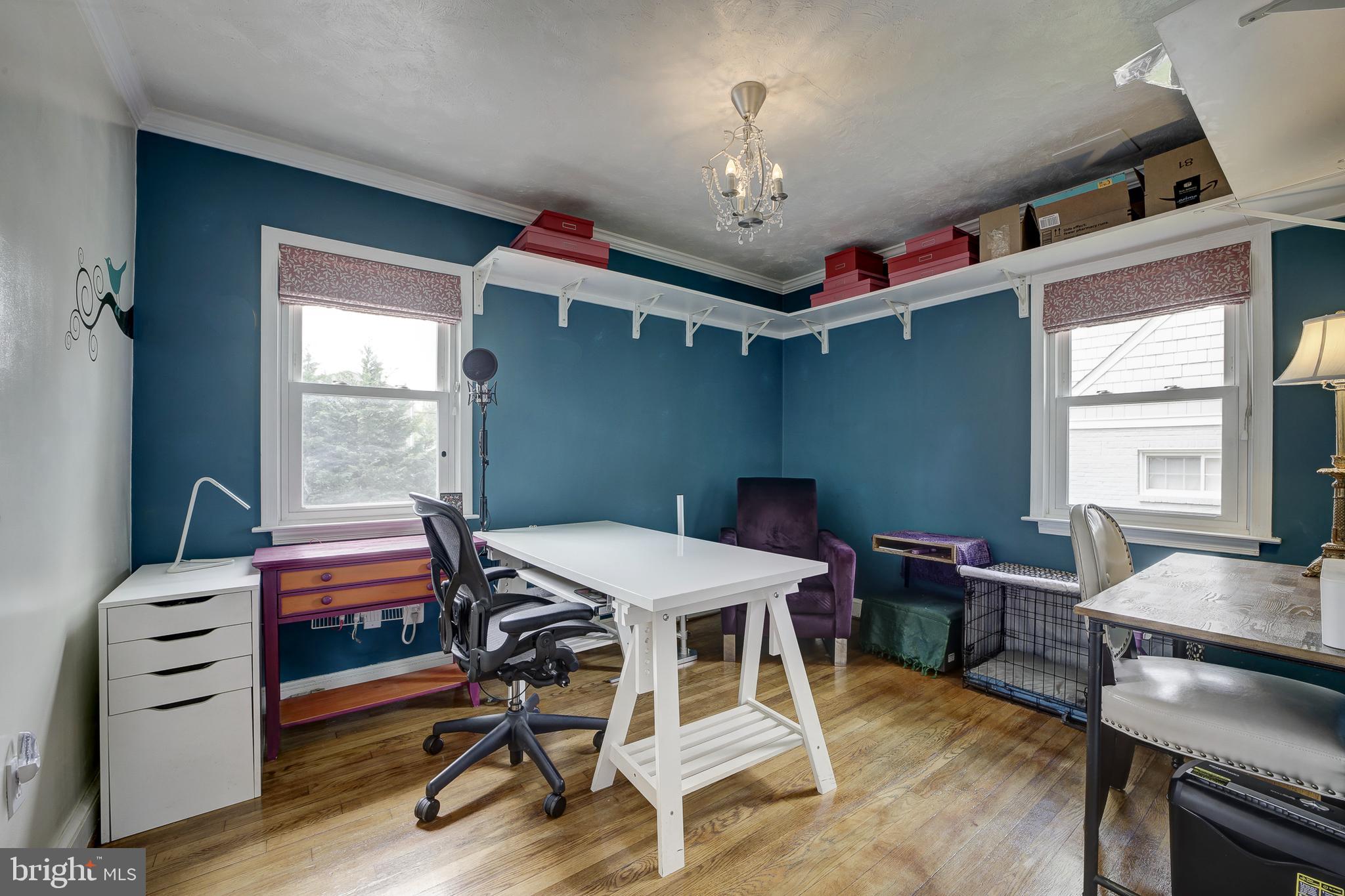 311 Timberwood Avenue Silver Spring, MD 20901 - Photo 20 of 44 a workspace with chandelier