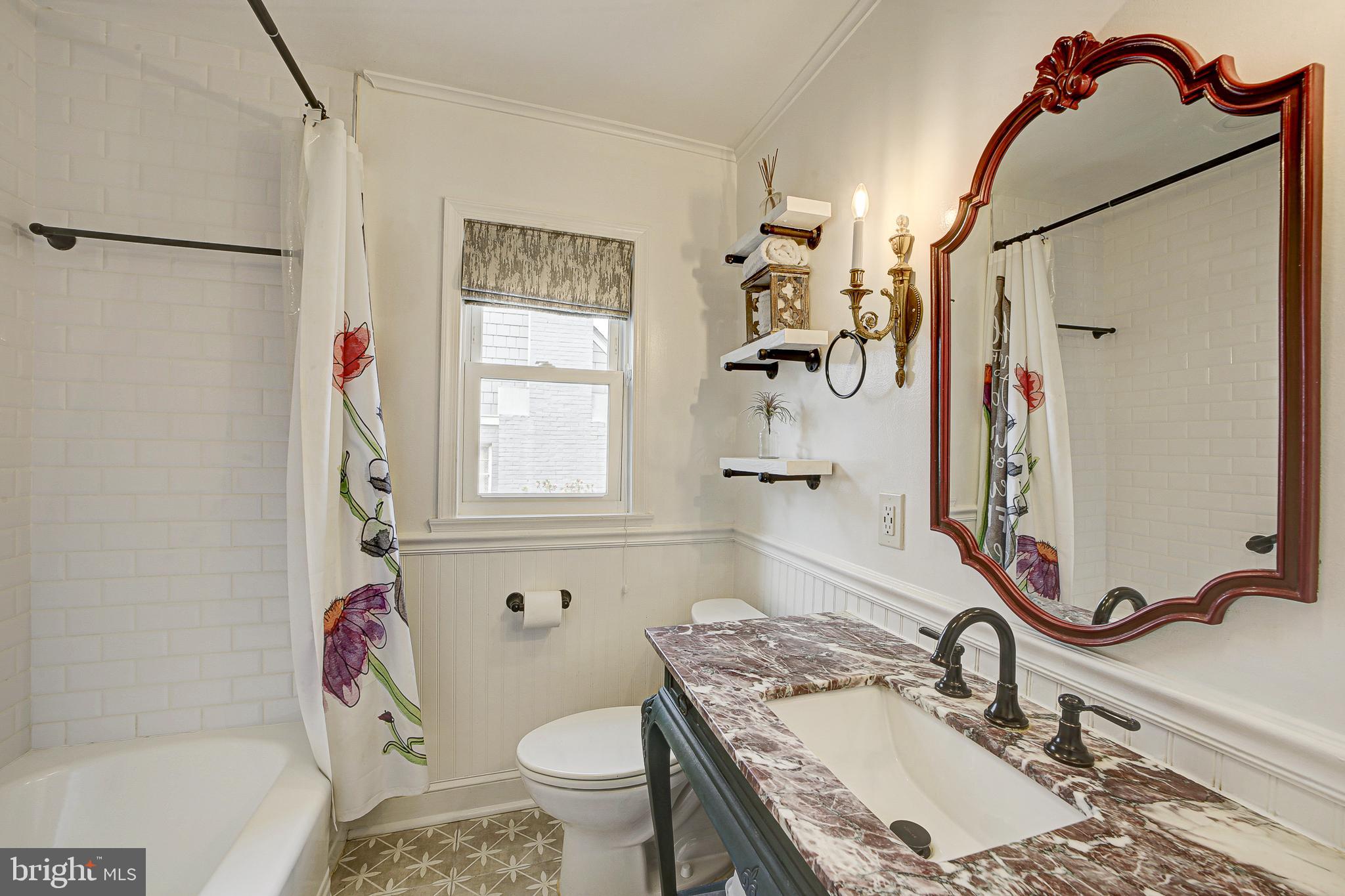 311 Timberwood Avenue Silver Spring, MD 20901 - Photo 26 of 44 a bathroom with a sink toilet and shower