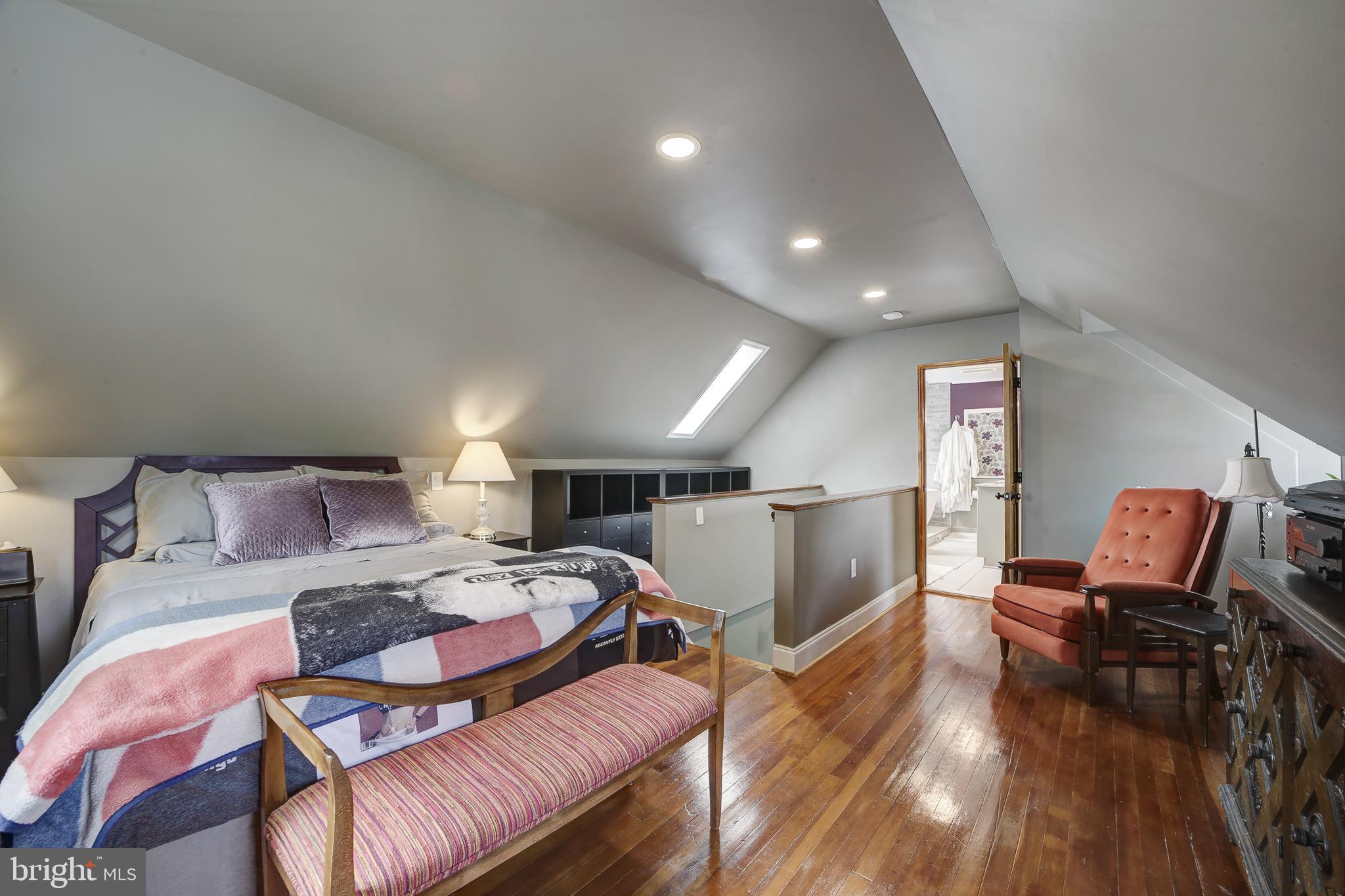 311 Timberwood Avenue Silver Spring, MD 20901 - Photo 28 of 44 a bedroom with furniture and wooden floor