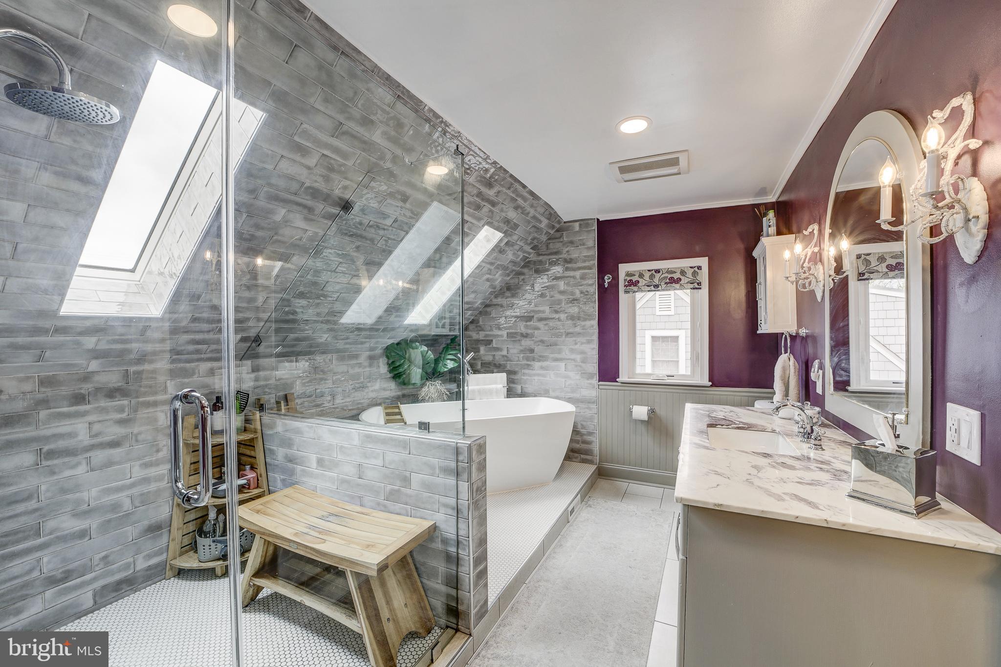 311 Timberwood Avenue Silver Spring, MD 20901 - Photo 29 of 44 a living room with furniture and a chandelier